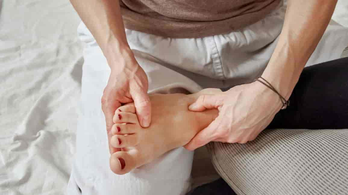 What part of the foot do you massage to relieve a Headache